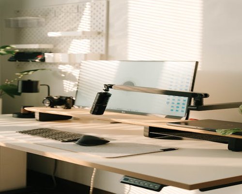 sunlight streaming through window on home office desk
